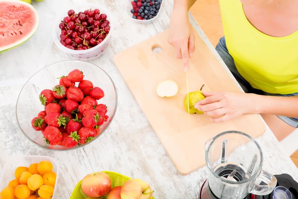 Mature woman preparing a smoothie